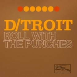 Albumcover von D/TROIT - Roll with the Punches; brauner Hintergrund, oben eine Reihe von roten und gelben Punkten, darunter die Titel/Artist in gelber und weißer Schrift