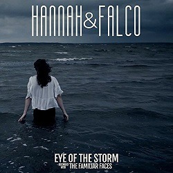 Albumcover von HANNAH & FALCO - Eye Of The Storm, eine Frau in einer weißen Bluse steht im Meer, es ist dunkel und stürmt