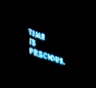 [Time is precious] Blurry Photo Of A Neon Signage. 